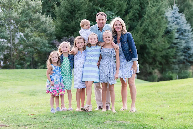 Andrea Canning with her husband and six children outdoors