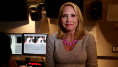 Andrea Canning in front of monitors during news editing