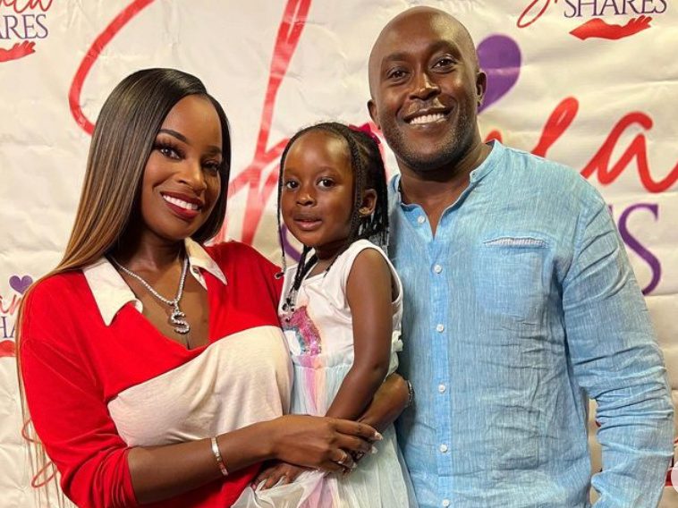 Gerald Mwangi with wife Shamea Morton and daughter Shya smiling together at a family event in 2025.