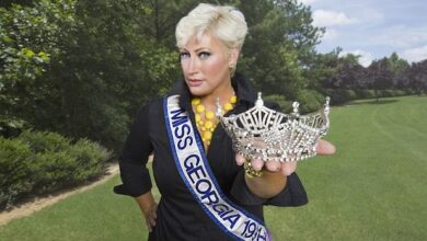 Kim Gravel smiling during a QVC fashion show, American TV host and entrepreneur presenting Belle by Kim Gravel collection in 2025.