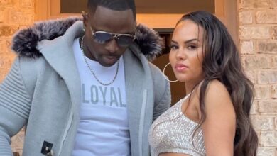 Rod Gardner and his wife Leticia flexing in orange fitness outfits outdoors